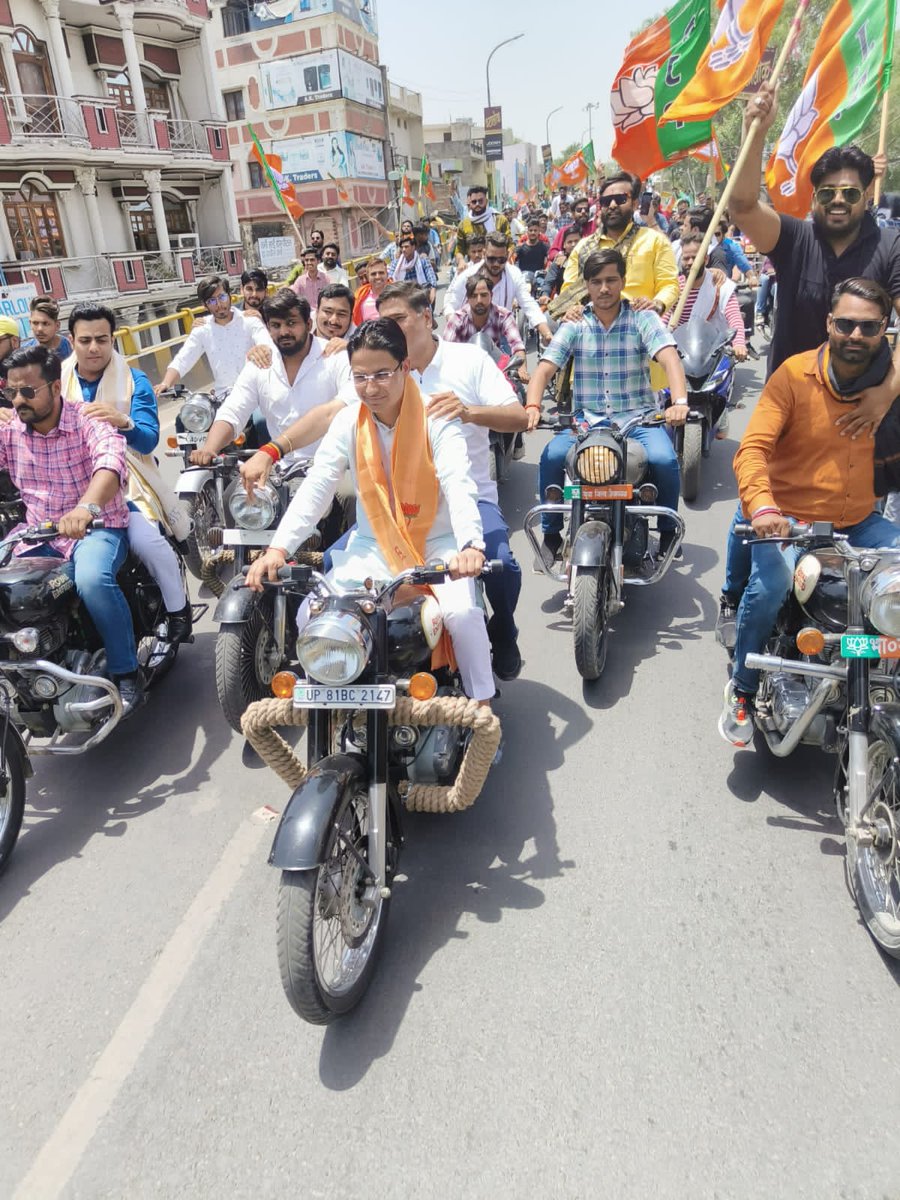 BJYM's tweet photo. BJYM National General Secretary &amp; MP Shri @RajuBistaBJP led ‘Vikas Teerth Bike Rally’ of @BJYMinUP karyakartas in Aligarh to celebrate PM Shri @narendramodi’s #8YearsOfSeva https://t.co/3G28DDUjsx