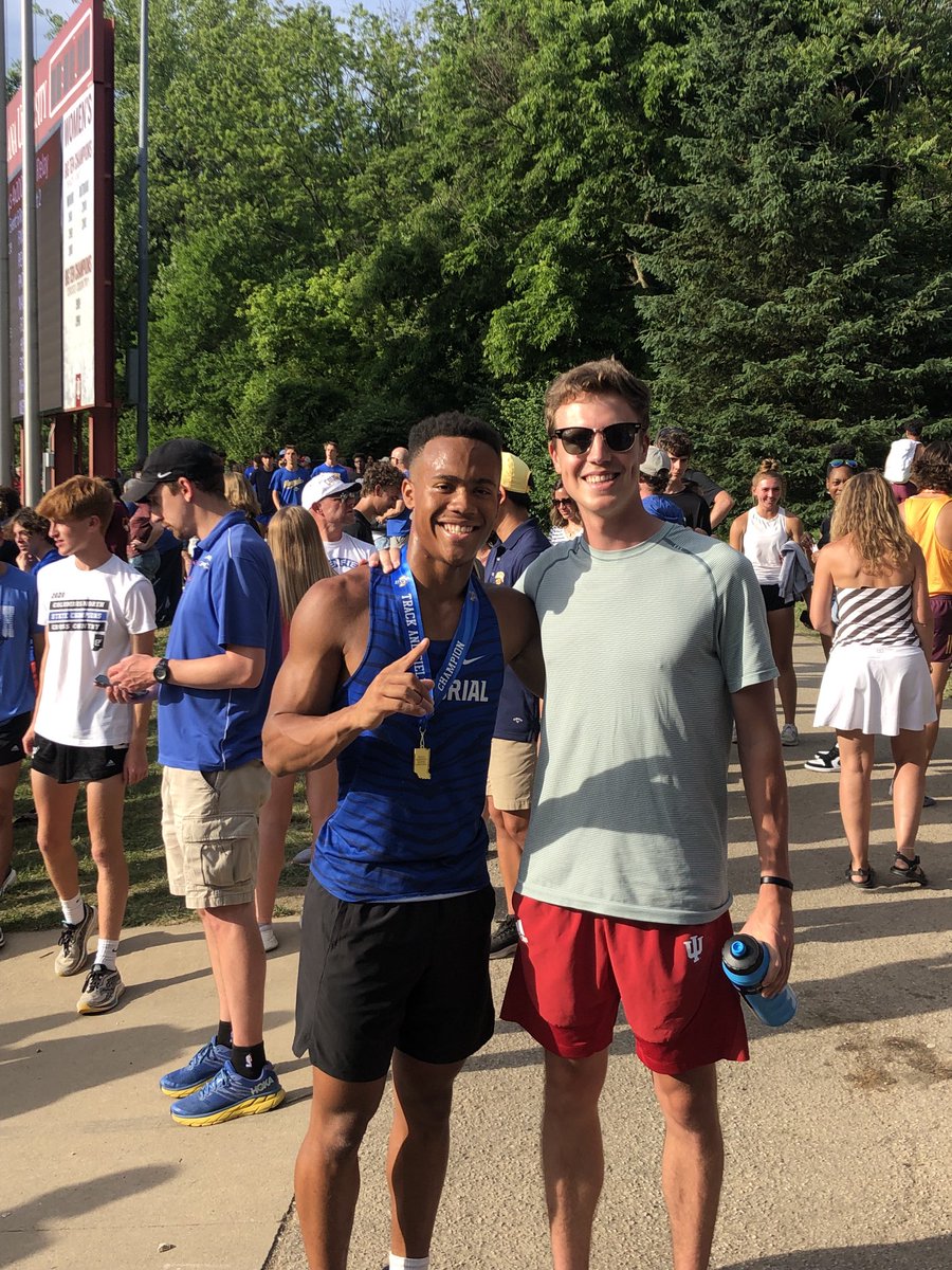 Matt Schadler (former State Champion for MHS in the 1600m) with Ray Brodie after the 100m Final.