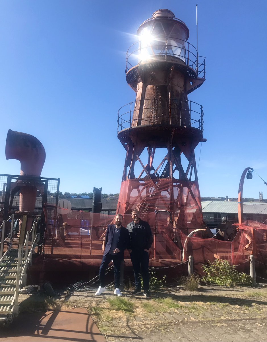 CILIPScotland's tweet photo. Ahoy there boys (or should that be buoys?!) Our incredible keynote speaker @Damian_Barr and Head of @CILIPScotland @SeanJMcNamara1 have been enjoying the delightful Dundee sunshine in advance of #CILIPS22. We see bright skies ahead for Scotland’s libraries! ☀️ https://t.co/X3EdyIIYIx