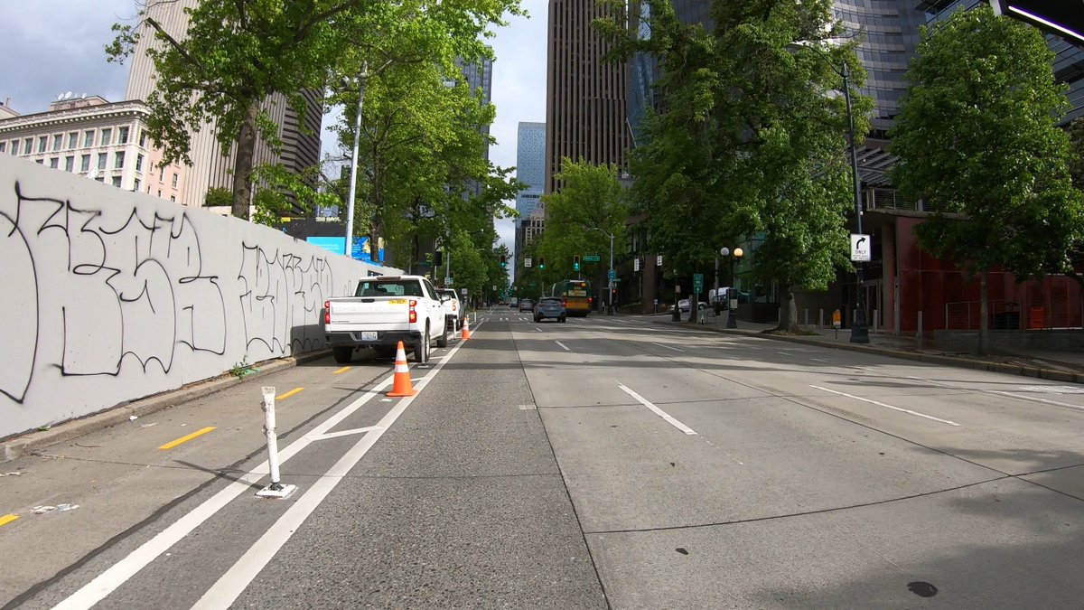 bobco85's tweet image. I passed through there this morning, too, and had to detour into the traffic lane (they didn’t say anything to me); here are screenshots from my GoPro

I agree, SDOT easily could have blocked a traffic lane to allow people using bicycles/scooters/etc to safely pass #SEAbikes
