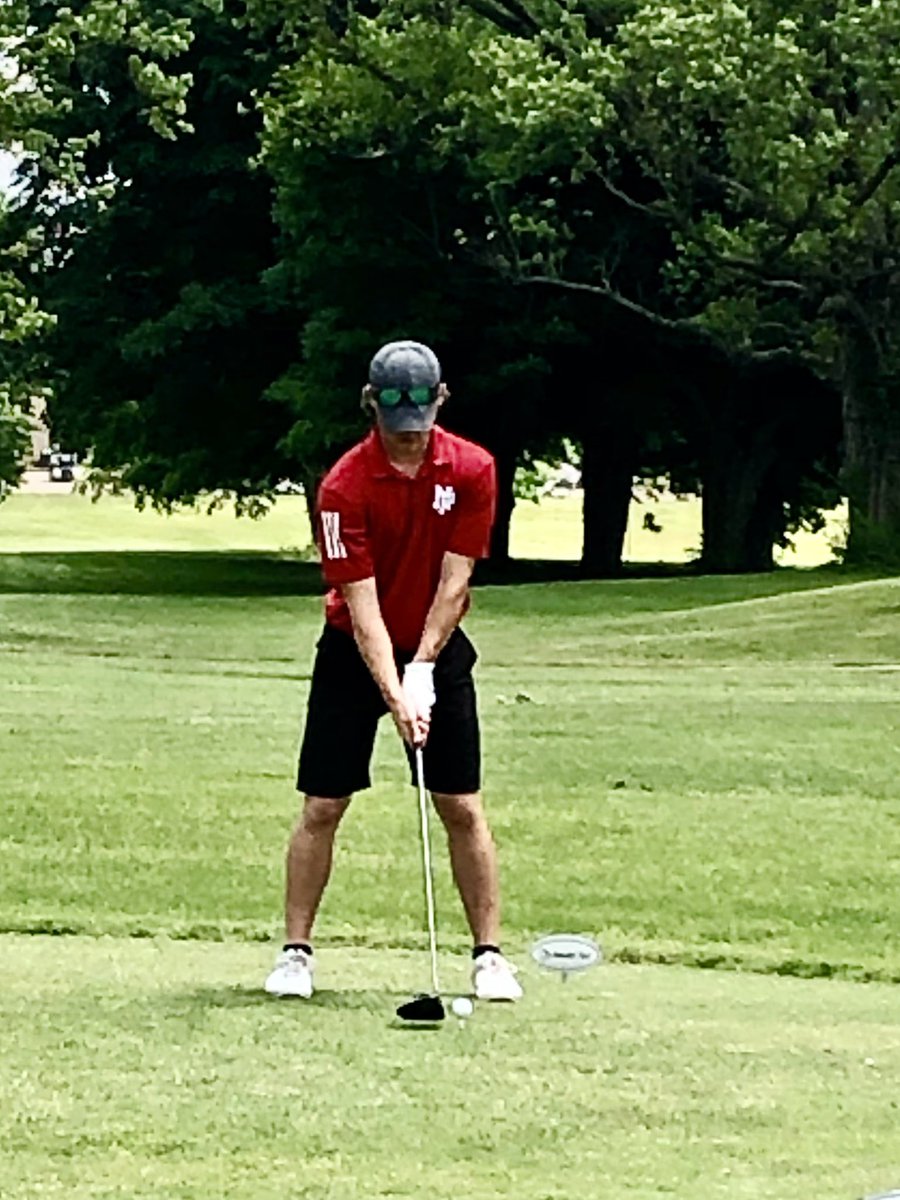 Senior Dragon Evan Griffith hammers his tee shot on the 16th during sectional play.