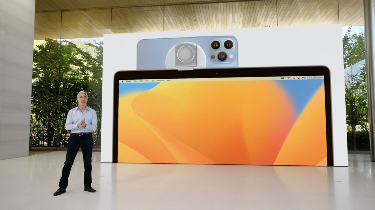 ijustine's tweet photo. Continuity camera: use your iPhone as a webcam! The coolest thing is being able to go to desk view.. it uses the wide angle camera to show both the desk and you in the same shot! Whoa! 

#WWDC22 https://t.co/3l5reNL9ge