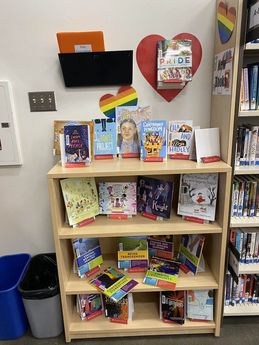 Aloonaroo's tweet photo. @BakerChair Our parent council donated funds to our school library to increase our diversity and inclusion books. Here is the display I’ve had up since the beginning of May with some of the new and old books with Pride characters or theme. I am super proud of the support I get in my school. https://t.co/NvpLXKjBvC