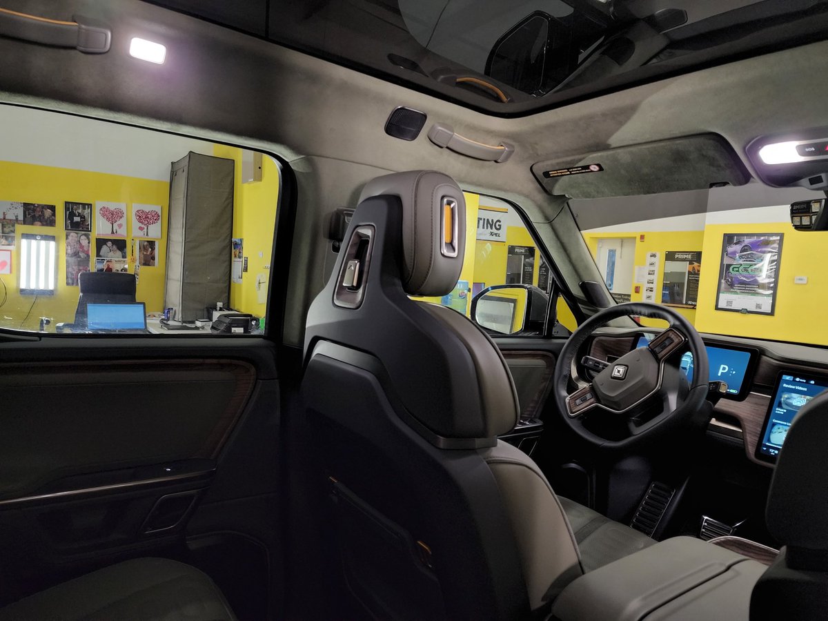 tintman's tweet photo. 2022 100% Electric Rivian R1T Pickup Truck Windows Tinted with Xpel Prime XR Black Ceramic Window Film at Tint Man FL's Winter Garden location @tintman #rivian #tintmanfl #xpel @xpel 70% windshield, 30% front doors, 55% on top of factory smoked rear windows &amp; 15% visor strip. https://t.co/A0H0vhq1Np