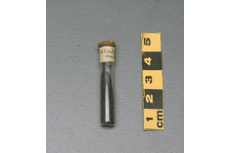 2012.0243.001 Glass container with a cork stopper  metal specimen and paper label A stored geological specimen kept as material for preparing microscope slides. v.gd/8Mn0I3