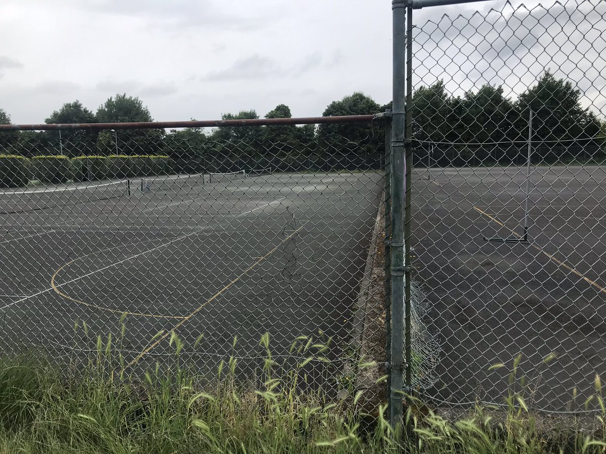 Hard to believe that @Merton_Council is the home of tennis. 12 locked & abandoned courts in #WimbledonPark <200m from hugely wealthy developers @Wimbledon. Cc @the_LTA are you proud of your banner here? #ShamefulWaste   @carolinecm96