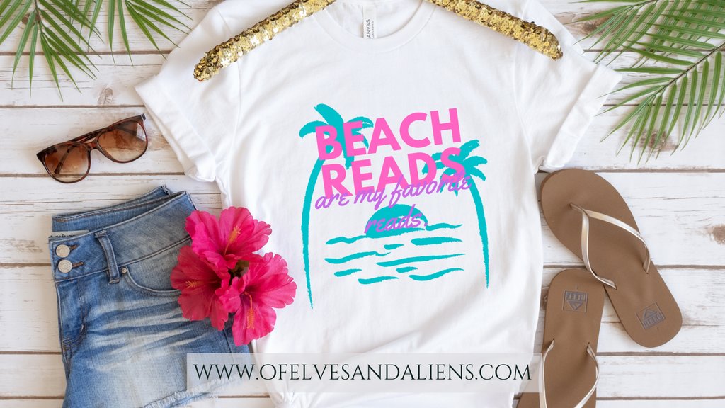 Embrace ur love of the beach and books w/ this delightful tee. This t-shirt is everything you've dreamed of &amp; more.

Check out my link tree to access the Of Elves &amp; Aliens catalog. 

 #bookmerch #booknerdmerch #Ofelvesandaliens #Beachreads #Summerfun #tshirts