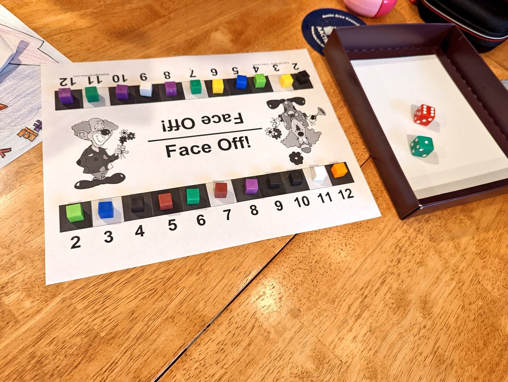 Dad: We're going to play Face Off again, but a version with 2 dice instead of 1. What do you notice about the board?
Me: It has more numbers.
Dad: Why do you think that is?
Me: I don't know.
Dad: How will I roll and get 12?
Me: ...Oh! We're going to add the dice together.