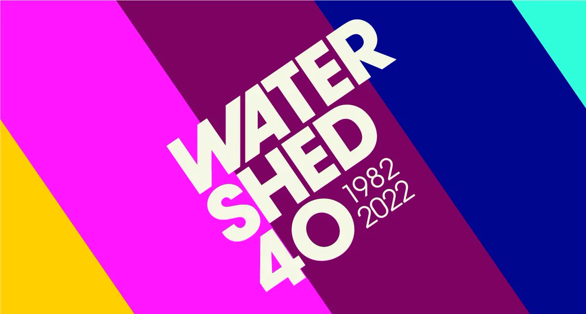 Watershed 40 - 1982 - 2022 on a striped background. The colours are yellow, pink, purple, blue and turquoise.