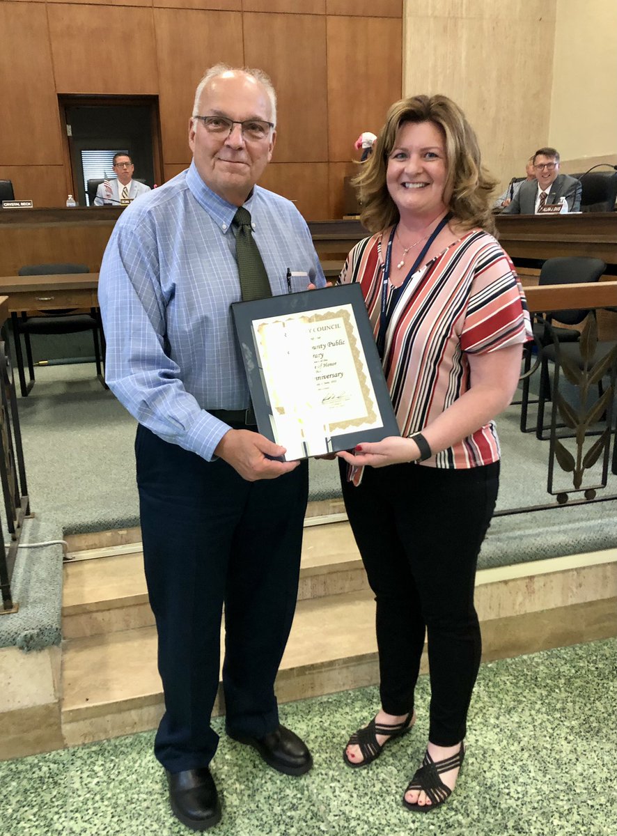 ParmaMayor's tweet photo. At last night’s council meeting, Council Clerk Ken Ramser presented Parma-Powers Branch Manager Holly Camino with a certificate recognizing @CuyahogaLib 100th anniversary. Happy birthday to the best library system in the country! #100thanniversary #100thbirthday #bestlibrary https://t.co/N6BKi16M4E
