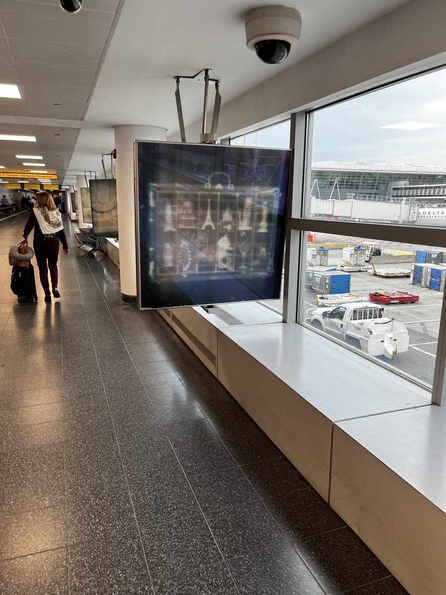 EthanLowens's tweet photo. I’m guessing that ⁦@JFKairport⁩ went over budget on a recent renovation and that’s why they’re using X-rays of people’s luggage as hallway art??? https://t.co/VmeI1lnK81