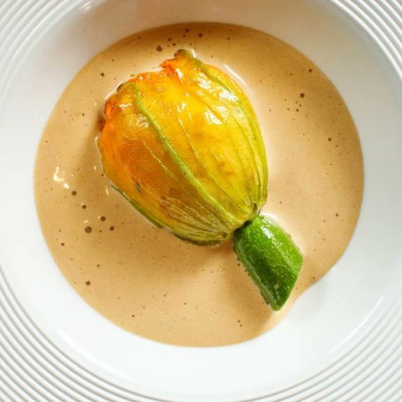 One of Chef <a href="/graham_neville/">Neville Graham</a> most popular dishes is back on the menu. Beautiful <a href="/Ionafarm12/">Donnacha Donnelly</a> Courgette Flower stuffed with Dursley Island Lobster and Dublin Bay Prawns with a Lemongrass &amp; Ginger Bisque. We're open Wednesday to Saturday for lunch and dinner dax.ie