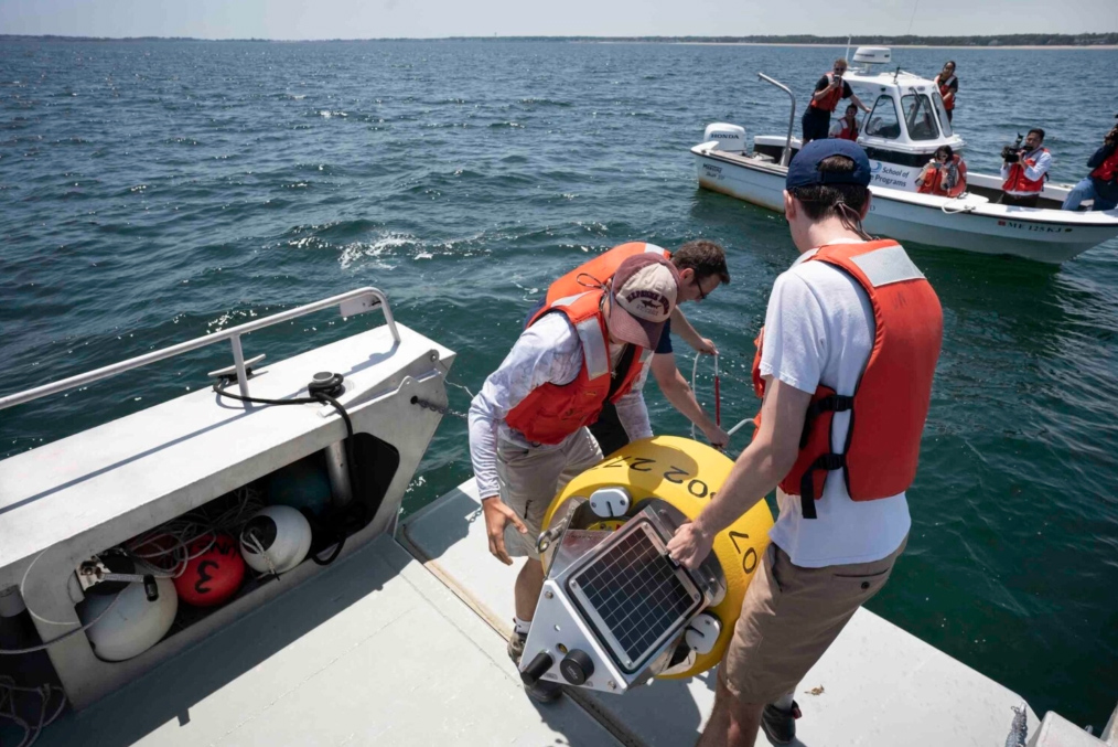 Shark news: University of New England students Clayton Nyiri, left, and Ben LaFreniere deploy a buoy with Assistant Professor John Mohan on Saco Bay on Tuesday. The buoy sends an alert if a tagged white shark is nearby. 

<a href="/gregoryrec/">Gregory Rec</a> photo