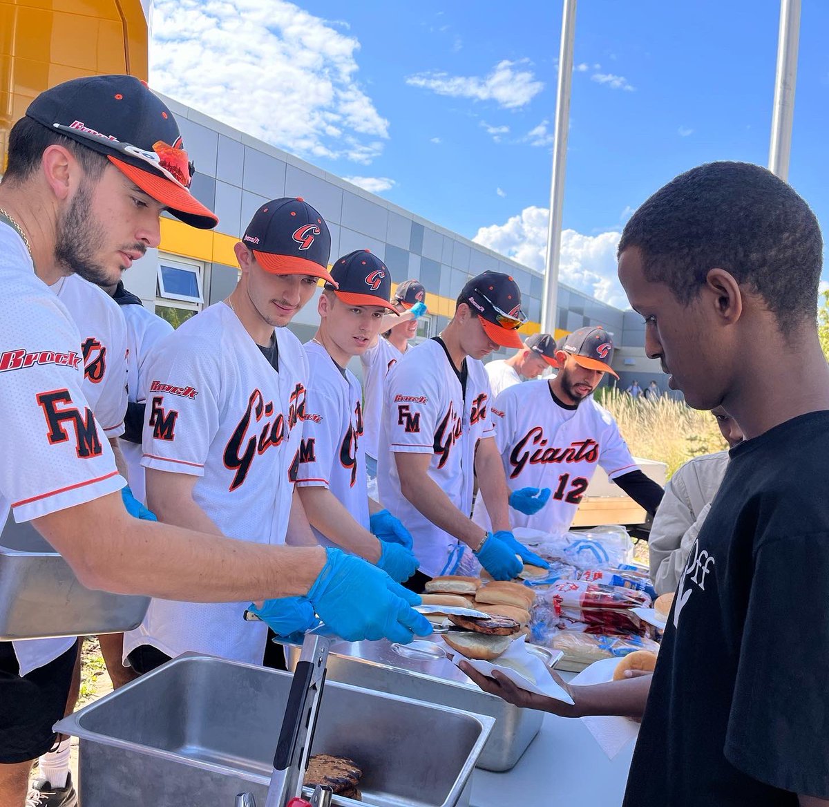 The_ELLTeacher's tweet image. Thanks again @FMMGIANTS for #servinglunch @CompMinerTweets #NewComers enjoyed their 1st #BBQ ever in Canada 🇨🇦 #community #YMM @RMWoodBuffalo @FMPSD @LindaMywaart @jjvelvet @annaleeskinner #MinersPride 💛🖤 #RoleModels #Sports #Baseball #SoGrateful @mca4wb