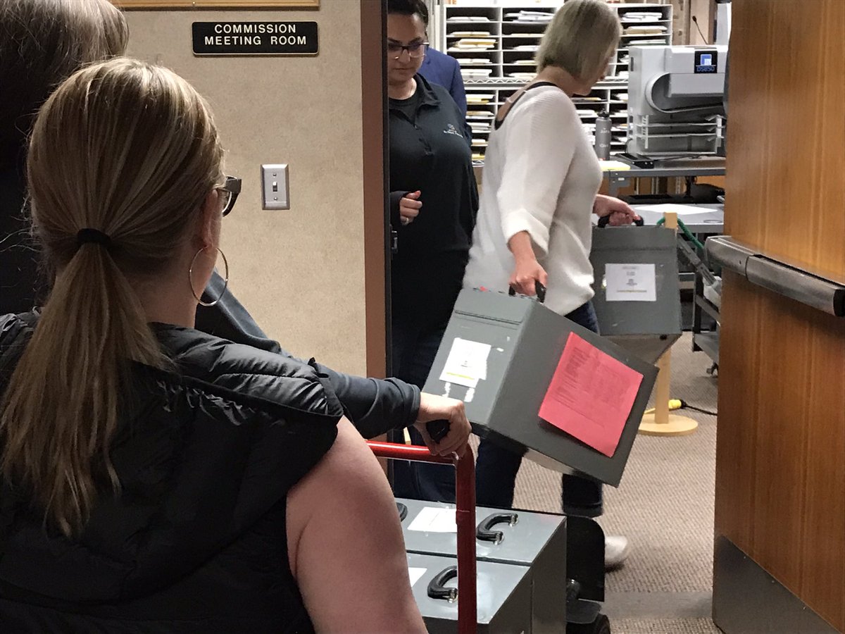 Metal boxes contains precinct ballots are arriving at the Minnehaha County admin building.  The counting will start soon. #kelonews
