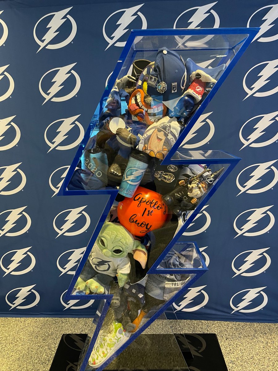 wyshynski's tweet photo. Intermission reading: The @TBLightning collected their fans' luckiest charms -- including tiki dolls, a Baby Yoda and a "Weekend at Bernie's" cardboard cutout -- to display in the arena and take on the road! My story on #CallToCharms ➡️ https://t.co/vTq3Kgcq9Y https://t.co/FVAZgFhQ31