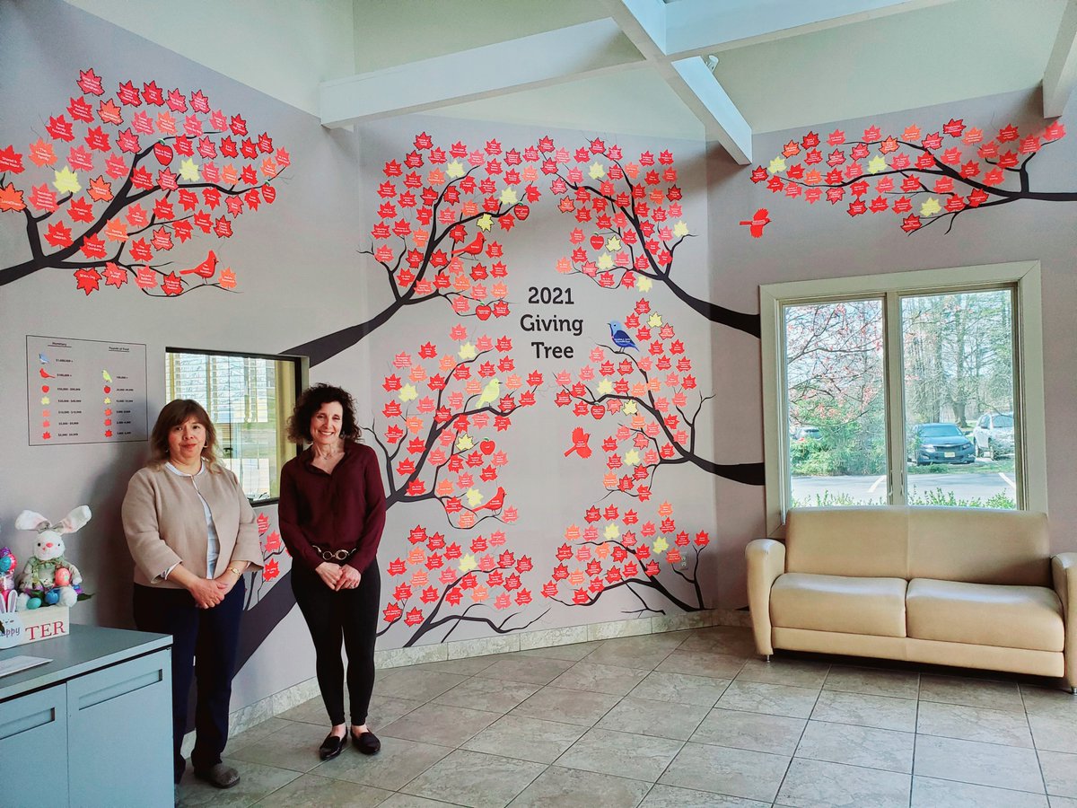 Angela Cordova, REA PRIDE Chair and Sandra Benedict, Development Director of the Interfaith Food Pantry Network by the IFPN Giving Tree where the Randolph Education Association received its  leaf recognition.<a href="/Randolph_EA/">Randolph Ed Assoc.</a> <a href="/RandolphSchools/">Randolph Schools</a> <a href="/NJEA/">NJEA</a> <a href="/RandolphTwpNJ/">Township of Randolph</a>