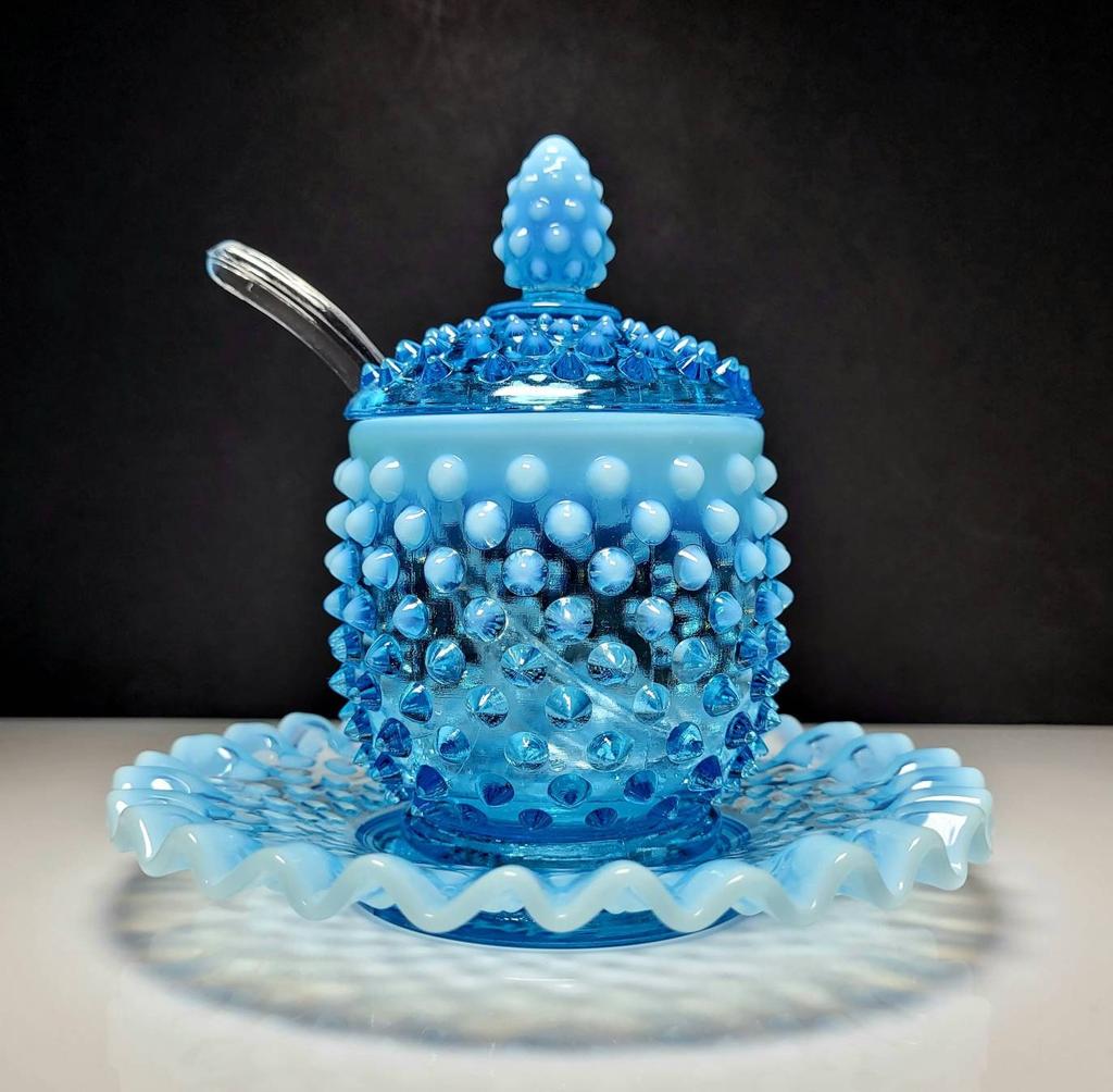 MarketLotus's tweet photo. Excited to share the latest addition to my #etsy shop: Fenton Art Glass Company #3903 Blue Opalescent Hobnail Four-Piece Jam Jelly Set with Lid, Spoon, and Underplate, 5.5"H #fenton #fentonhobnail #midcenturyglass #blueopalescent #fentonjelly #fentonjamset https://t.co/0acmTszzFc https://t.co/XSAr1Cjxgz