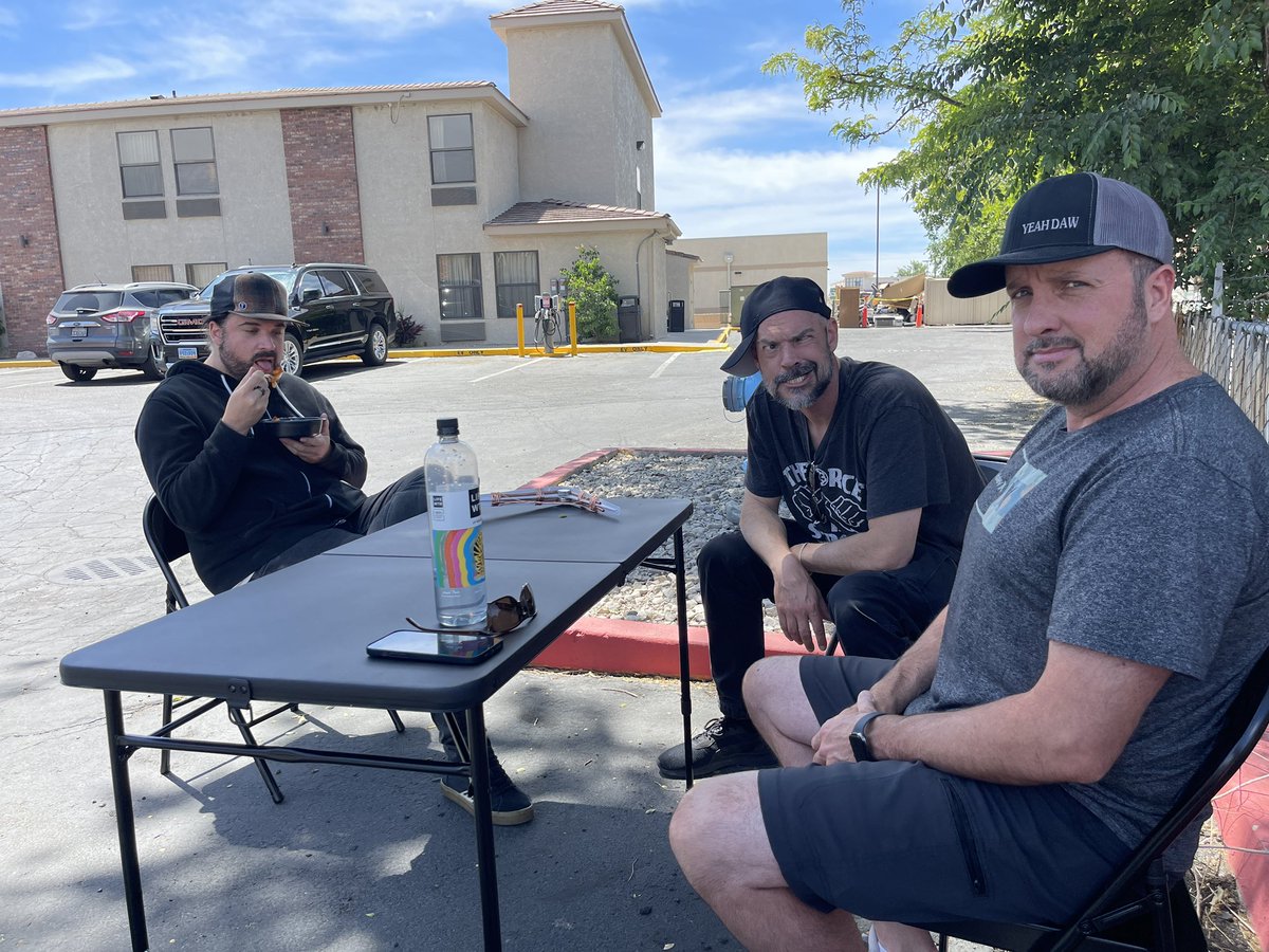Zak_Bagans's tweet photo. This is an actual photo of us in a hotel parking lot waiting for call-time… we made a chill spot with a table and chairs from Wal-mart… they are very uncomfortable and Jay is eating microwaved plant-sausage. Bill is annoyed and Aaron is…….Jus being Aaron. #GhostAdventures https://t.co/lLXEUd1gI8