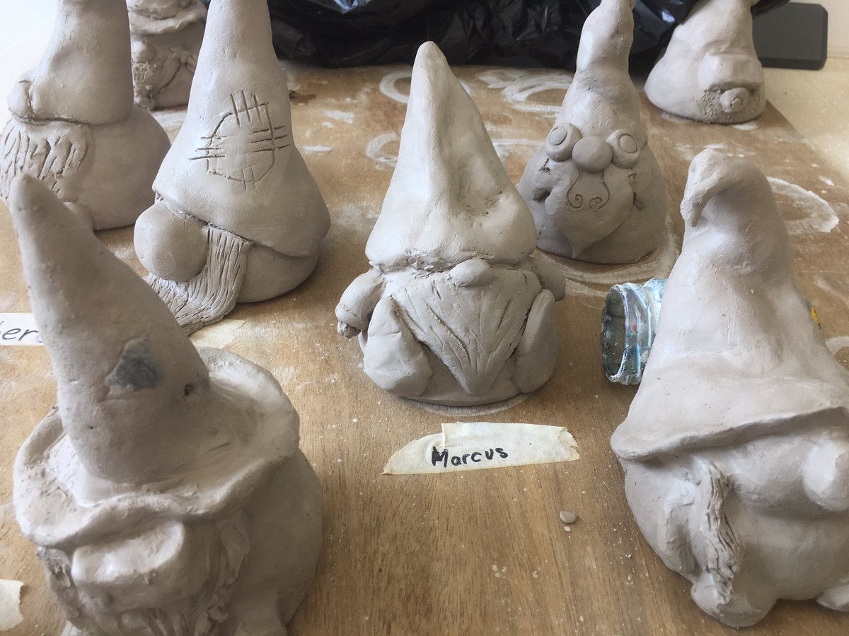 EmilyHillVAEd's tweet photo. Our garden gnomes are now on display in the green areas around the school! Easy way to teach student pinch pot building and a range of glazing techniques. #arteducator #arted #clay https://t.co/qB3nfZTghk