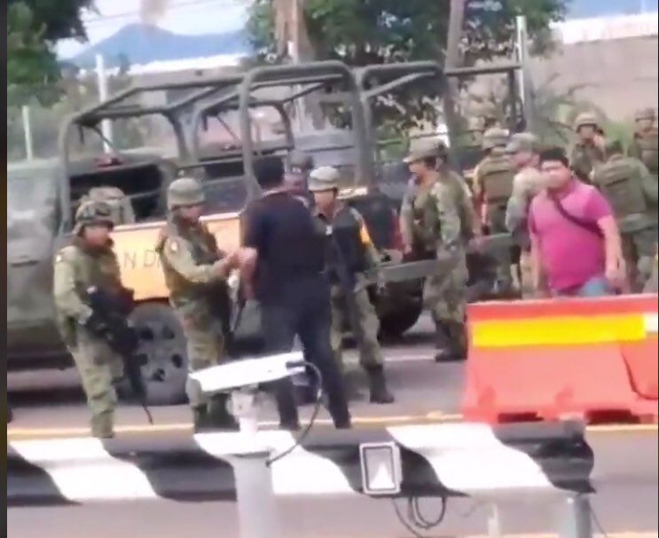 Photos of the army agreeing to stand down in exchange for their safety and safety of their families. Witnesses reported the cartels yelling out names of army members and names of their family members.