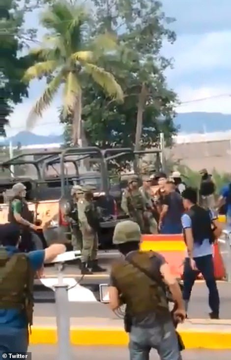 Photos of the army agreeing to stand down in exchange for their safety and safety of their families. Witnesses reported the cartels yelling out names of army members and names of their family members.