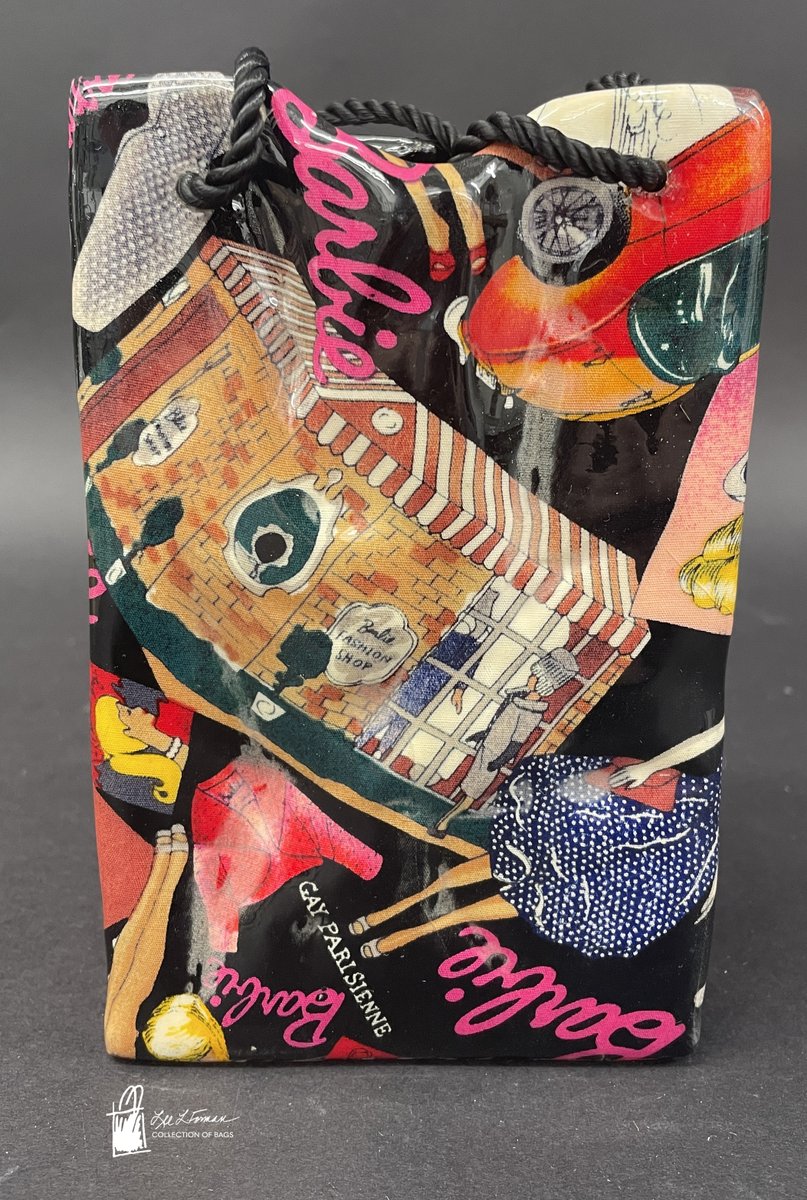 181/365: This ceramic bag was created by Nicole Miller for Mattel in 1995. It is painted in a collage of Barbie dolls and accessories including clothing, stores, and cars.