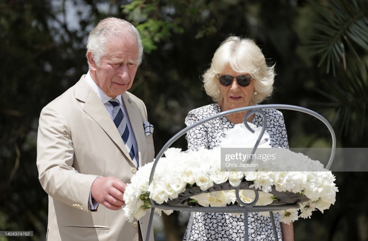ChrisJack_Getty's tweet photo. A poignant moment of reflection for The Prince of Wales and The Duchess of Cornwall as they lay a wreath at the Kigali Genocide Memorial in Rwanda today 🇷🇼 https://t.co/8PrGvdp7FG