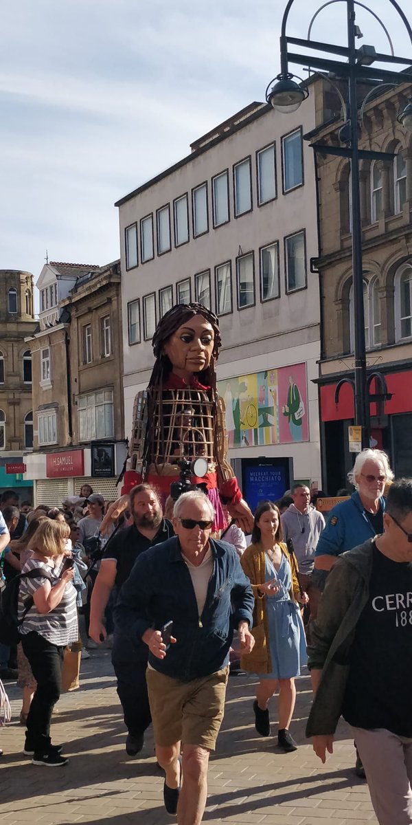 leedssanctuary's tweet photo. Anna and #leedscraftivists loved seeing Little Amal in Leeds on Monday, such a big crowd sending the message that refugees are very welcome in our city. @AsylumMatters 

#asylummatters #chooselove https://t.co/cLklmHywlX