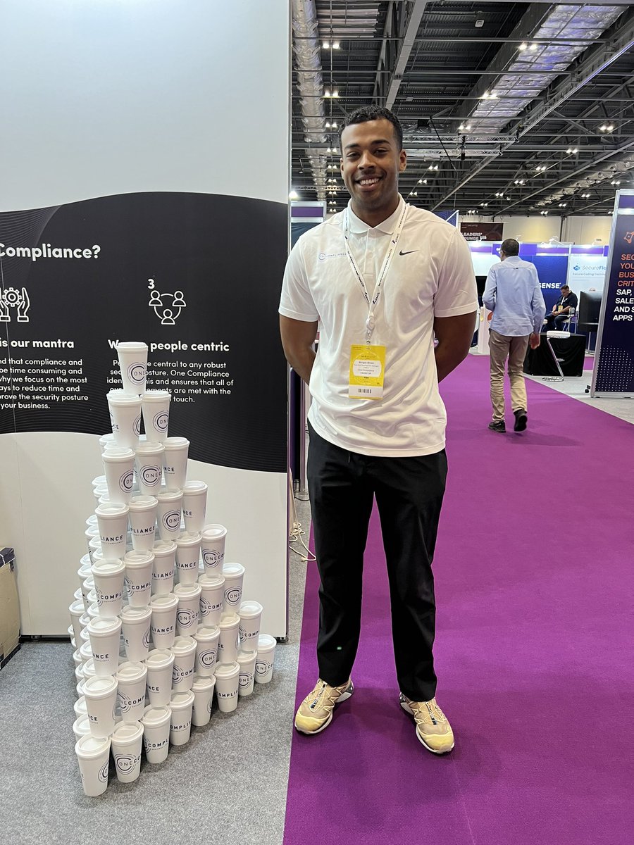 One_Compliance's tweet photo. Morgan rebuilt the Tower of Power after an overnight vacuum cleaner incident. #Infosec2022 https://t.co/DR08I0DDsE