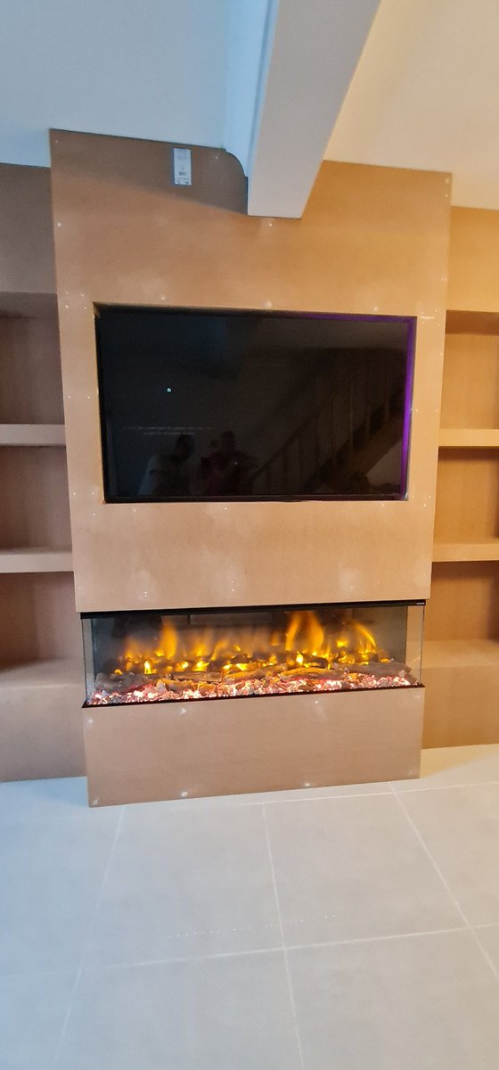 CarnCarpentry's tweet photo. Media wall with built in fire, to and storage to sides 🛠🔨🪚🪛 https://t.co/yQMePENyct