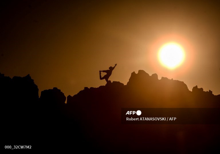 A Yoga seeker performs on the occasion of the International Yoga Day, on the archeo-astro in the north-eastern of the Republic of Macedonia.
A picture by #AFP photographer <a href="/RAtanasovski/">Robert Atanasovski</a>
