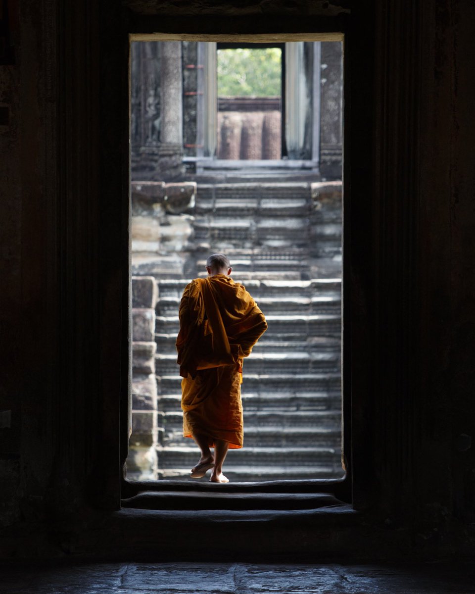 casadetake's tweet photo. A monk in the light, Angkor Wat, Cambodia https://t.co/Ojp0Q1JlLY