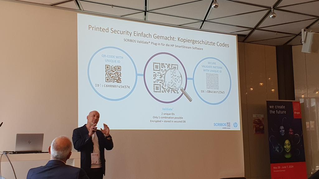 drupa's tweet image. Now @ScheibenstockS explains at #PrintDigitalCon how a QR code offers logical security and in combination with an individual security template two unique IDs are created that are especially counterfeit proof. Copy security is also guaranteed through this method.