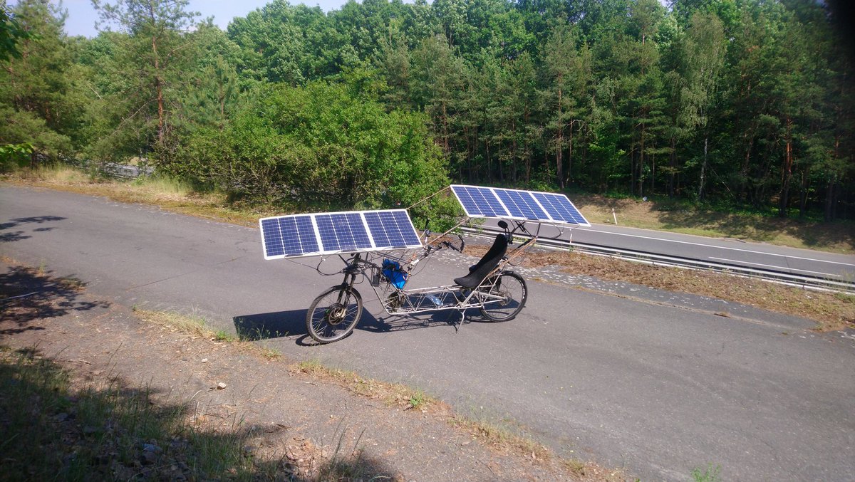 ArachneLabs's tweet photo. Record attempt this weekend was failure on so many levels, including need to recharge from public charger, punctured rear wheel and more. Performance of new panels is underwhelming, 50% of Wp, but basic #solarbike layout of panels is the best possible, combining shade and view. https://t.co/a7aAlCg4Yk