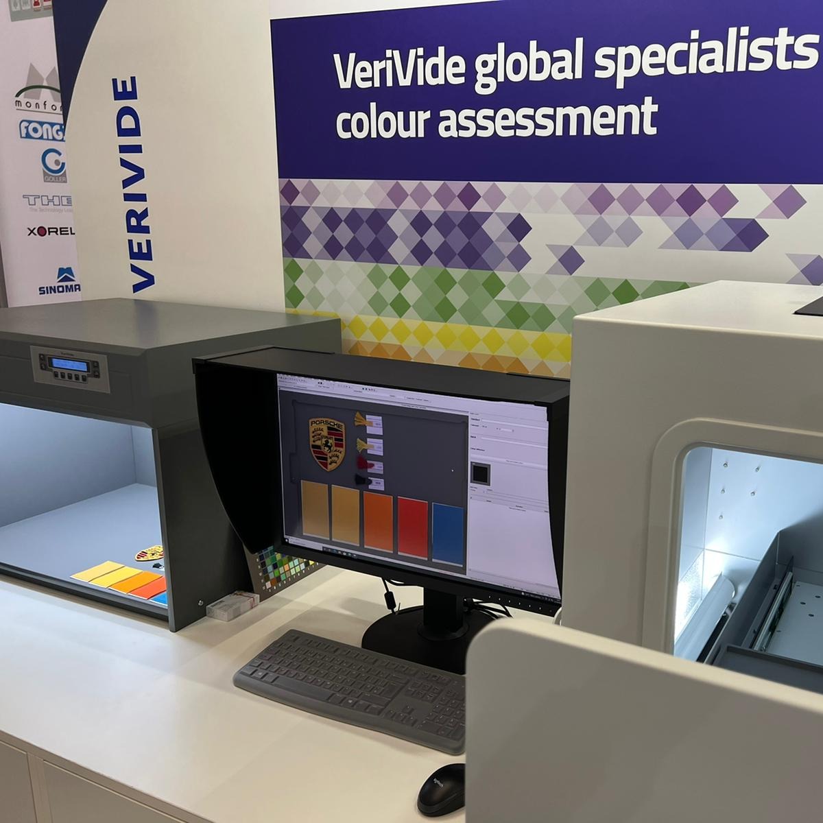 VeriVide's tweet photo. The knowledgeable Russell giving a demo, using a @Porsche logo, to a customer invited over by our German distributor @CarlvonGehlen of our Digieye system. ๐๐๏ธ They wanted understand light colour and wash fastness grading using #digieye and Russell was happy to help. #TechTextil https://t.co/ZmWvqHN0SU