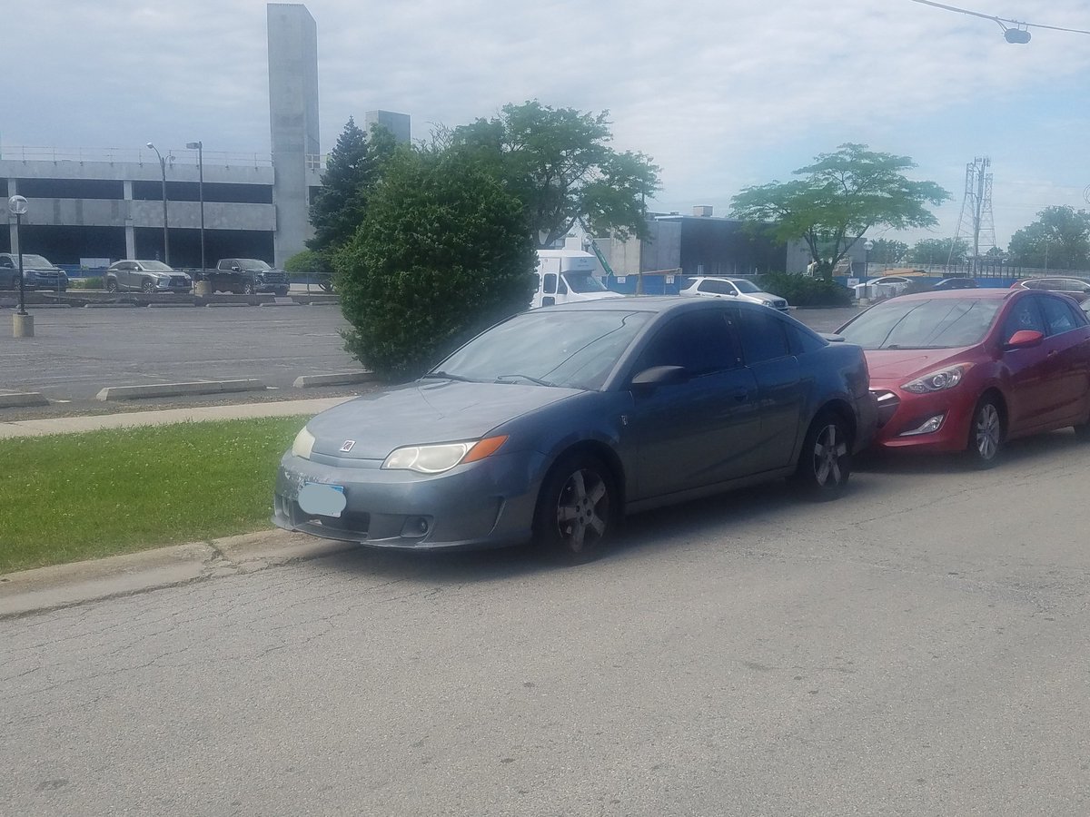 DamonRBell's tweet photo. A solid #CarSpotter find for me... can't remember the last time I've seen a Saturn of any sort, let alone an Ion Quad Coupe. This sure looks like a Redline front fascia to me, but  real Redlines had a bigger rear spoiler and 5-bolt wheels. @CollectibleAuto #SaturnIon https://t.co/XCs8Peic4B