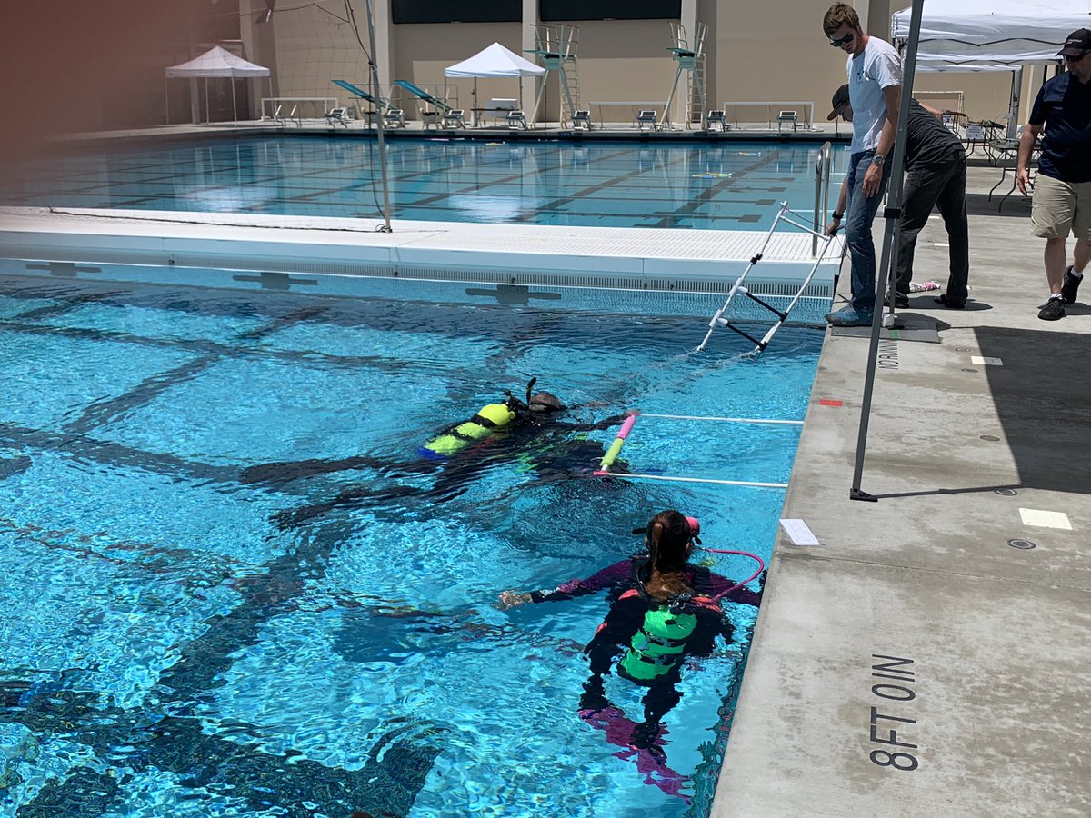 Our wonderful volunteer divers getting product demo stations all set up for tomorrow morning! #watergame #MATEROV #robotics
