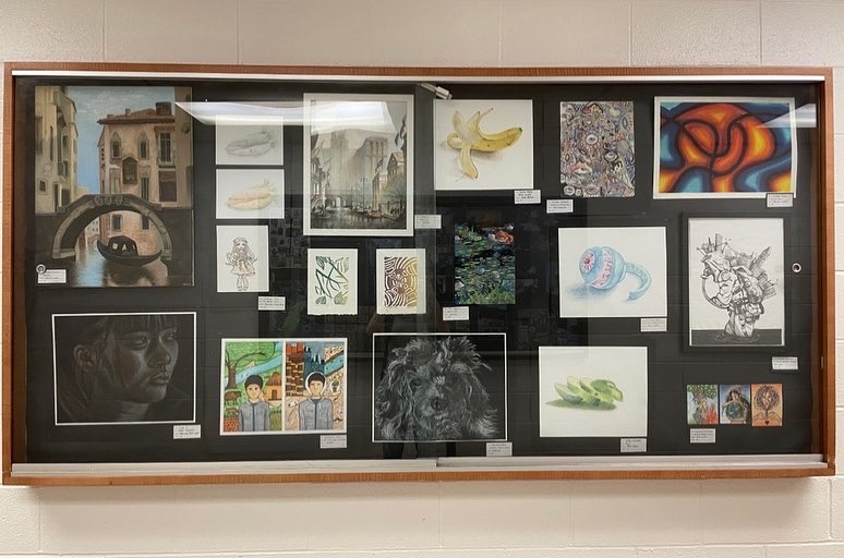Display cases throughout the first floor space were used to showcase the artwork and photography of the 2021-2022 arts students as well as the art on the lockers by the grade 12 Visual Arts students.