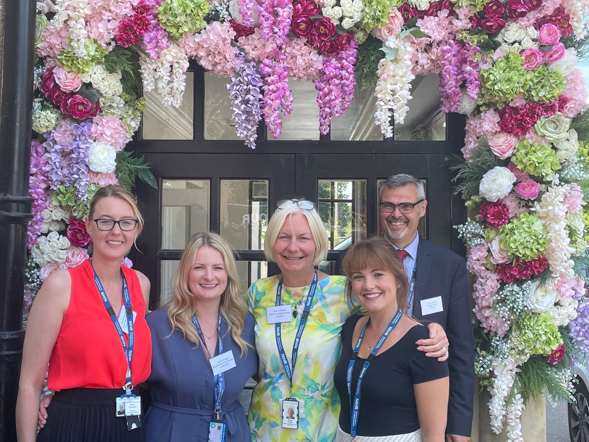A great day at the #tvraconference2022 - CRN team making full use of the flower arch! @NIHRCRN_NENCumb @sharondorgan2 @digi_tall_cs @NicolaCoverdal3