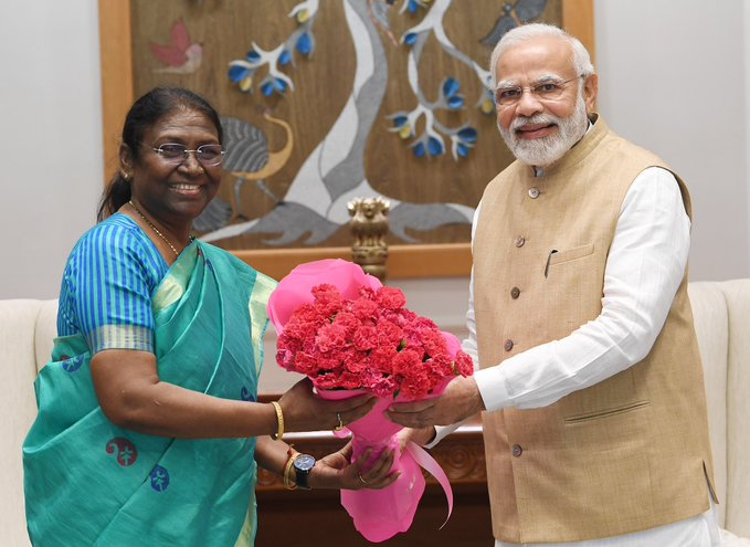 ANI's tweet photo. PM Modi meets NDA's Presidential candidate Droupadi Murmu, tweets, "her Presidential nomination has been appreciated across India by all sections of society. Her understanding of grassroots problems and vision for India’s development is outstanding". https://t.co/652kfDbguG