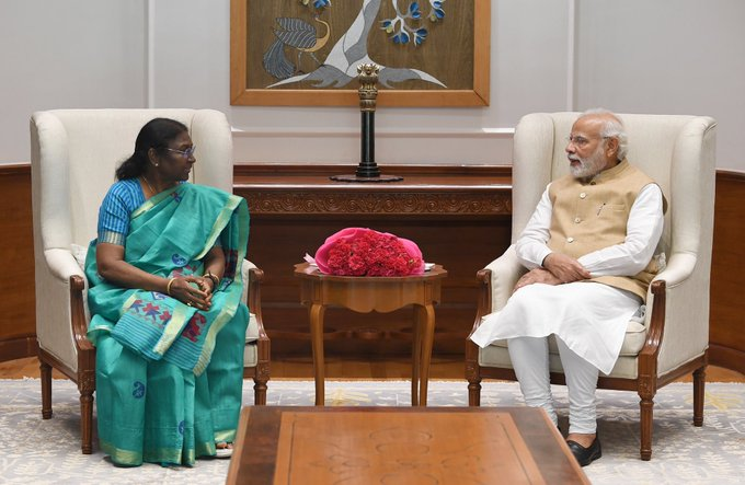 ANI's tweet photo. PM Modi meets NDA's Presidential candidate Droupadi Murmu, tweets, "her Presidential nomination has been appreciated across India by all sections of society. Her understanding of grassroots problems and vision for India’s development is outstanding". https://t.co/652kfDbguG