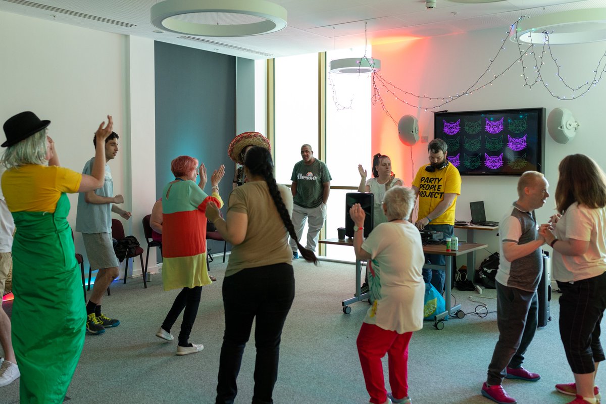 LeedsPlayhouse's tweet photo. Eat cake, rave, repeat! 🍰💃🎶🥳  
DJs from The Party People Project, people with learning disabilities, their families, carers and support workers have been having a wild old time with us today enjoying tea, cake and raving as part of our #OpenSeason. 
#LearningDisabilityWeek https://t.co/BroIv78X6g