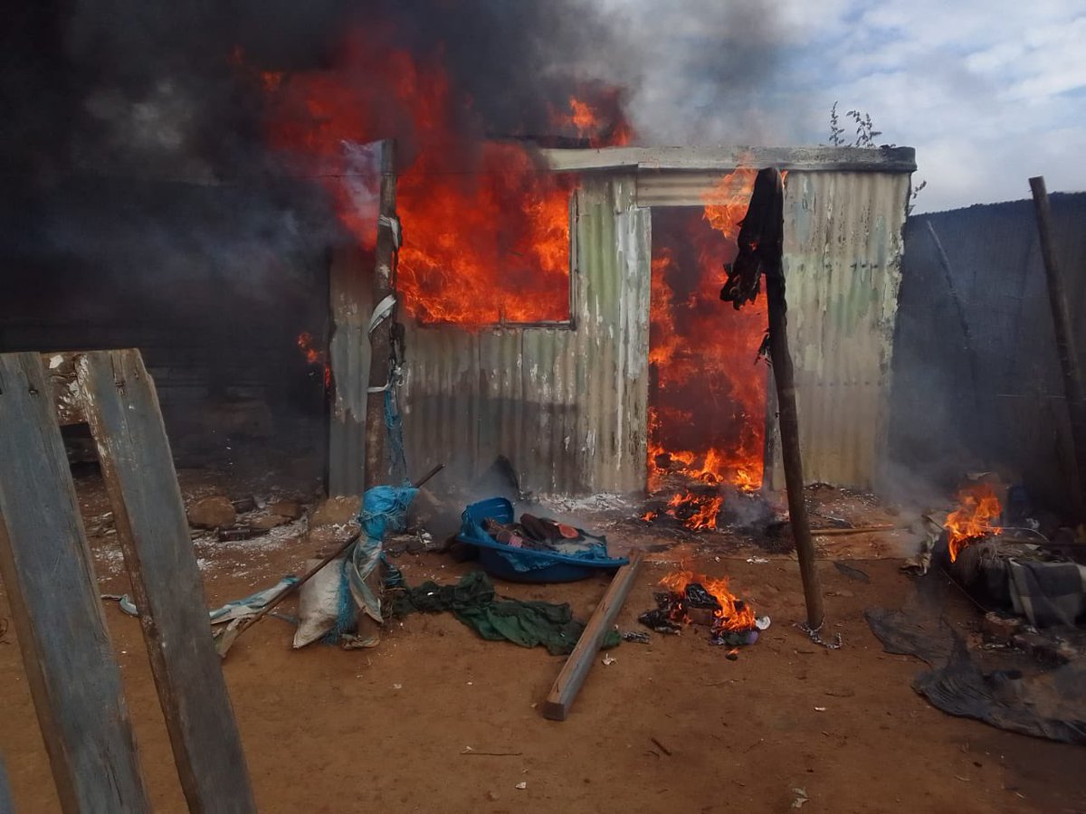 Abramjee's tweet photo. The shack of an alleged rapist set on fire: Daveyton. The suspect is on the run. A crowd attack his shack. https://t.co/RcZpYPaHrg