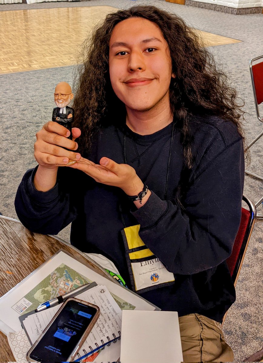 SMHSMission's tweet photo. @SanMiguelHS 's Emylio won third place in Lasallian trivia at the Young Lasallians Assembly! Check out his Brother George bobblehead prize! #YoungLasallians #SFNODistrict https://t.co/md8sDxgQ44
