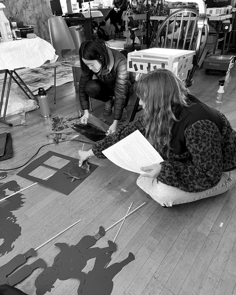 ShadowLightOrg's tweet photo. Any space can become a puppet workshop ✂️ Here's our Managing Director Caryl Kientz and artist Yawen Winnie Chien working on ShadowLight's Lunar NY show! https://t.co/dnrqdiv2iO