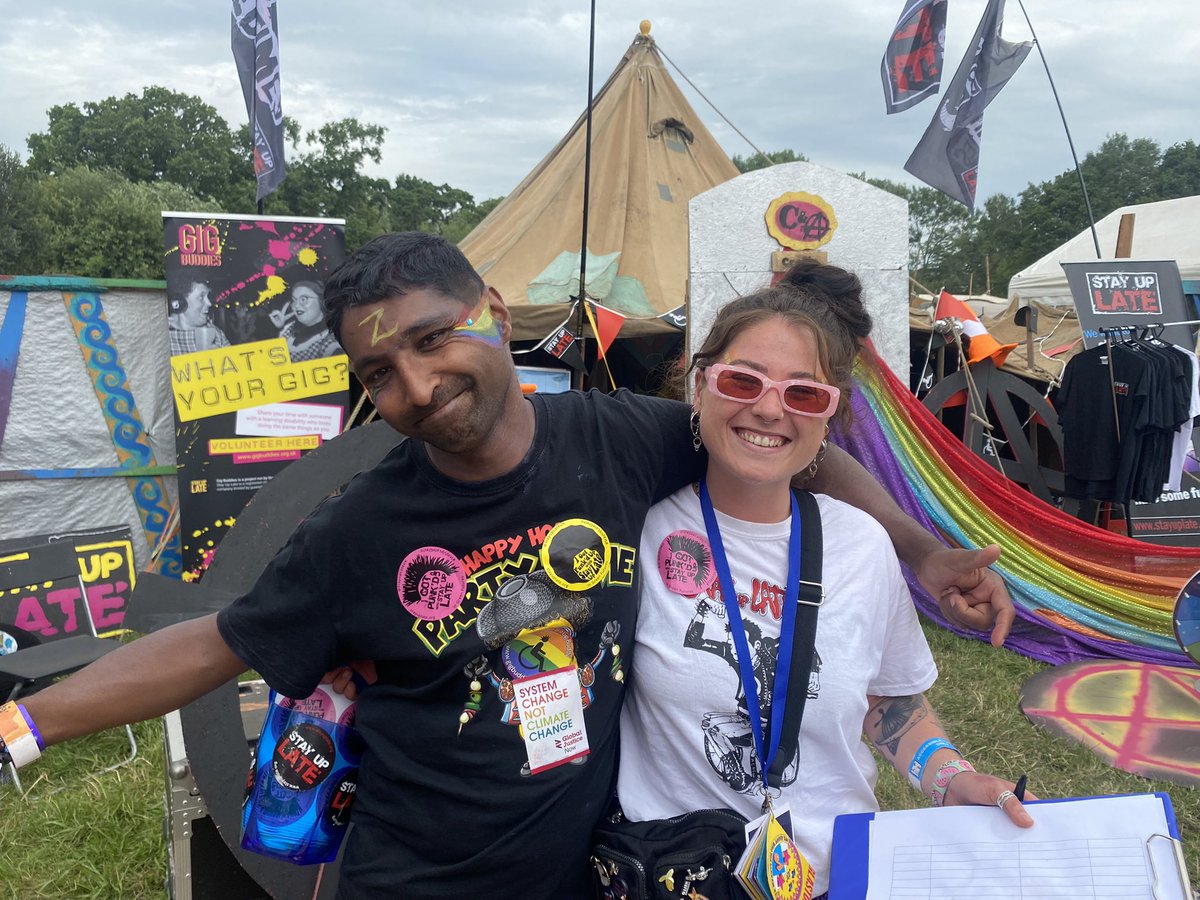 GlastoLive's tweet photo. Gig Buddies: Stay Up Late is a brilliant charity which pairs people with learning disabilities alongside volunteers who can accompany them to gigs they both like. Here’s reggae-loving Zi (left) with his gig buddy Sas. Check them out in the Green Futures field. JL https://t.co/uBUXB48RZz