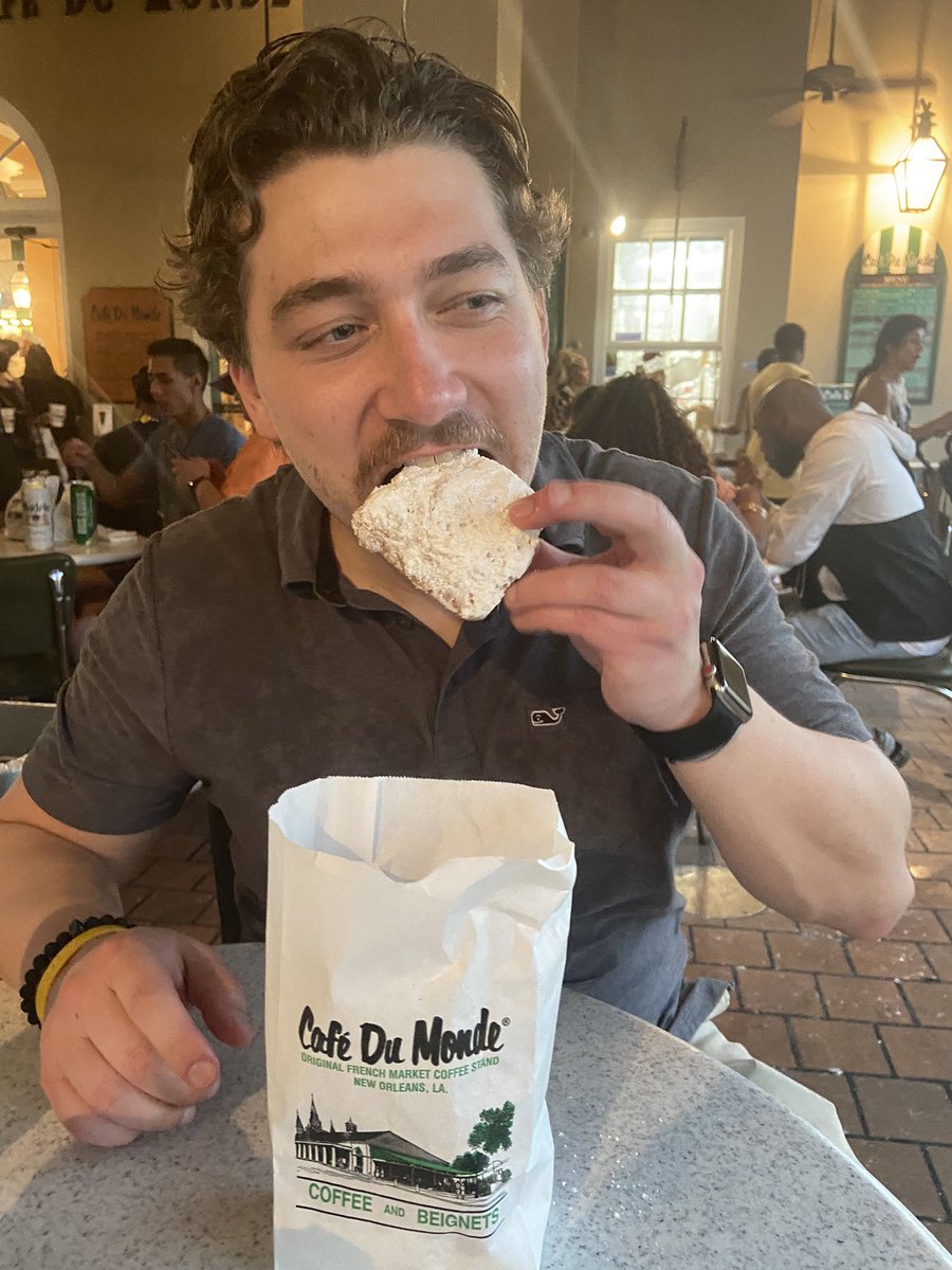 JamieGassmann's tweet photo. Introducing @ShaneMcNally25 to a #nola tradition #CafeDuMonde French beignets @R3_Continuum #shrm22 https://t.co/YLUZlGscmH