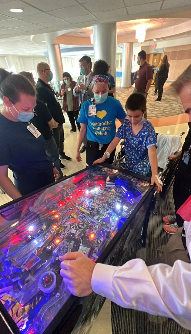 ProjectPinball's tweet photo. Yesterday on 06/10, the Project Pinball Team &amp; the community at Methodist Children's Hospital dedicated the #pinball machine Transformers by @sternpinballinc. Members of the San Antonio Pinball Enthusiast, Chris Doyle &amp; Mike McKenna joined us! #LAATour #ForTheKids #PinballNews https://t.co/m7TmZbySl0