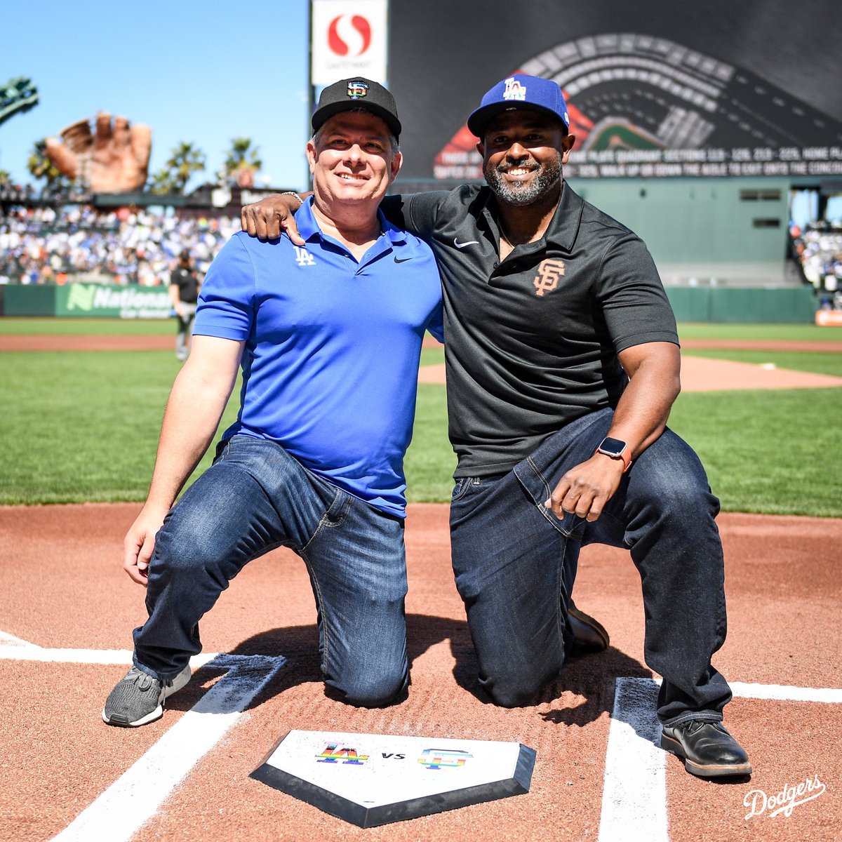 Dodgers's tweet image. For the first time in MLB history, the Dodgers &amp;amp; Giants wore Pride caps in the same game in support of the LGBTQ+ community. Dodgers SVP of Marketing, Communications &amp;amp; Broadcasting Erik Braverman &amp;amp; Giants VP of External Affairs Roscoe Mapps traded Pride caps prior to the game.
